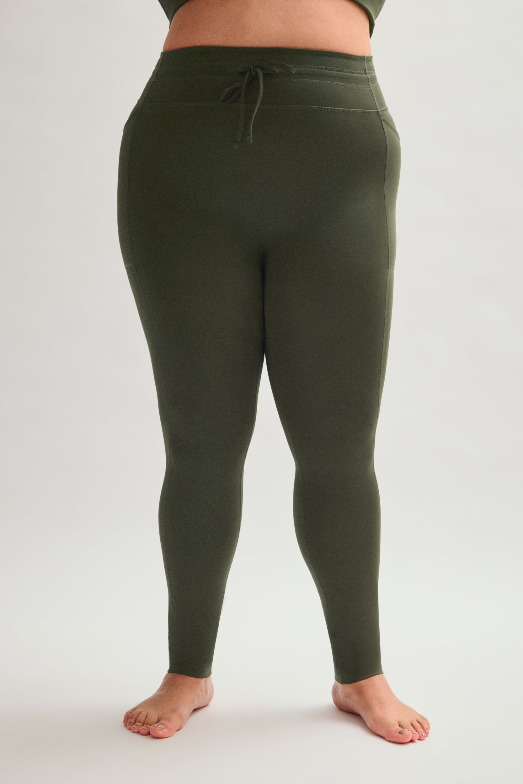 Legging de compression à cordon et poche plaquée
