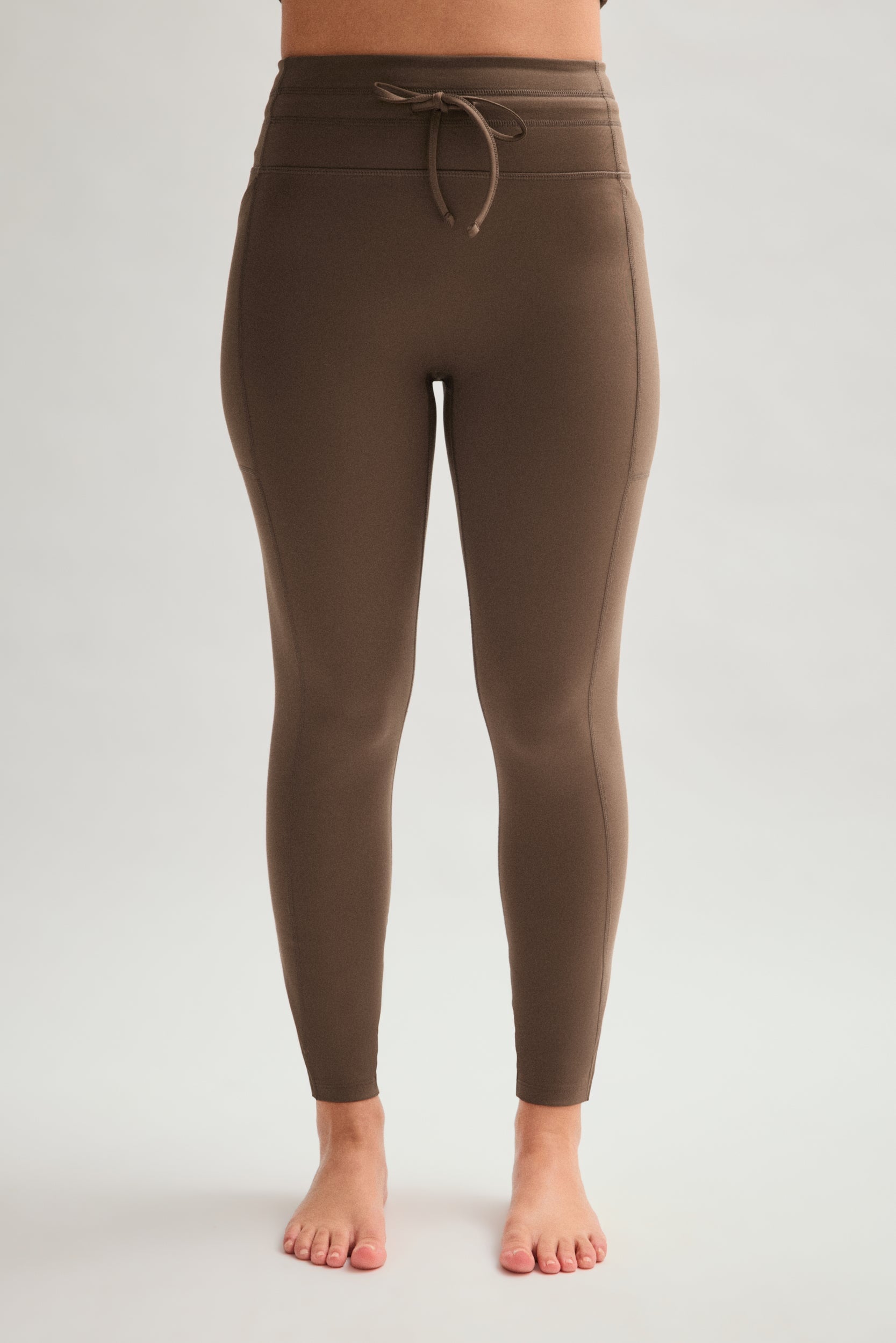 Legging de compression à poches et cordon de serrage