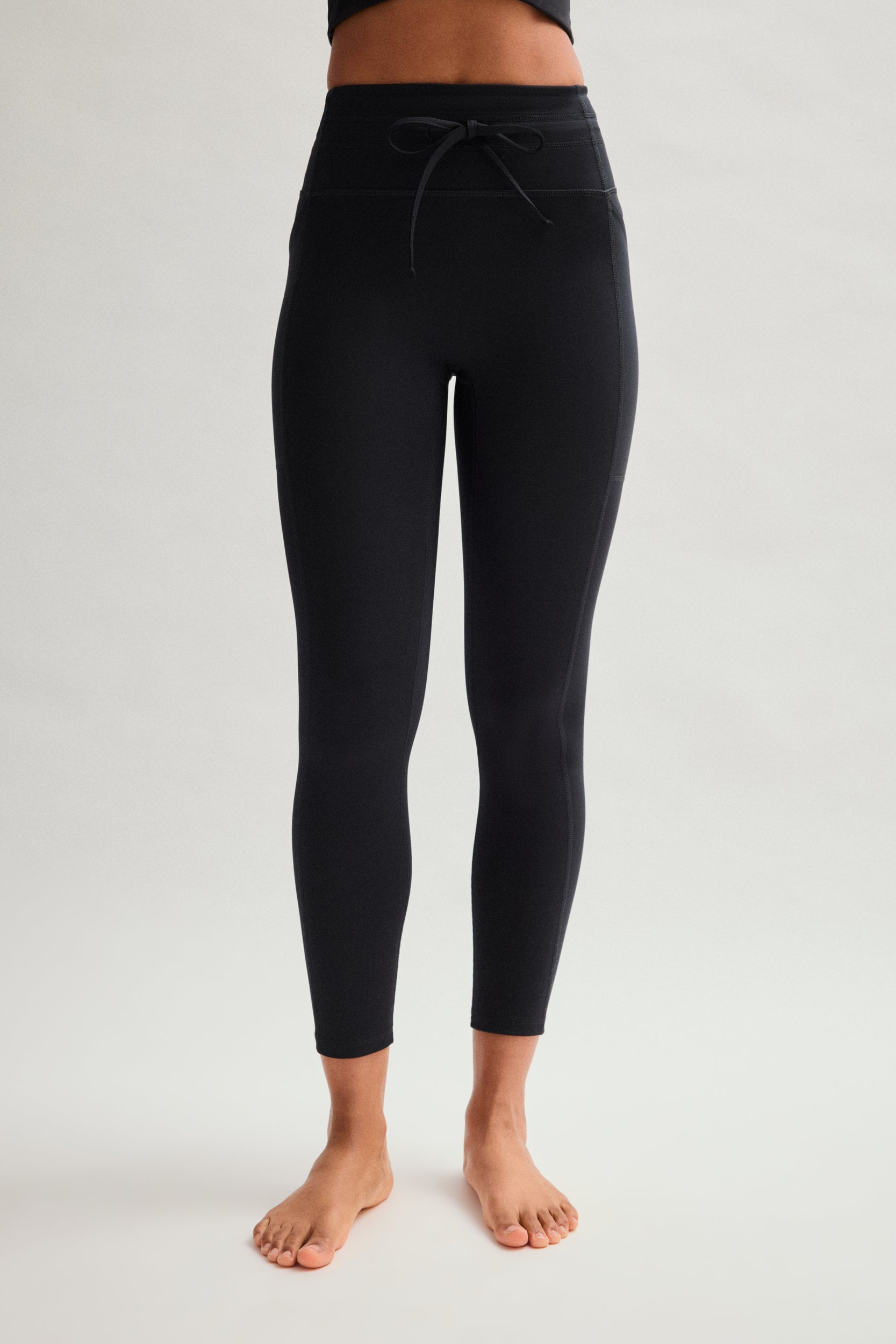 Legging noir compressif avec cordon de serrage et poches